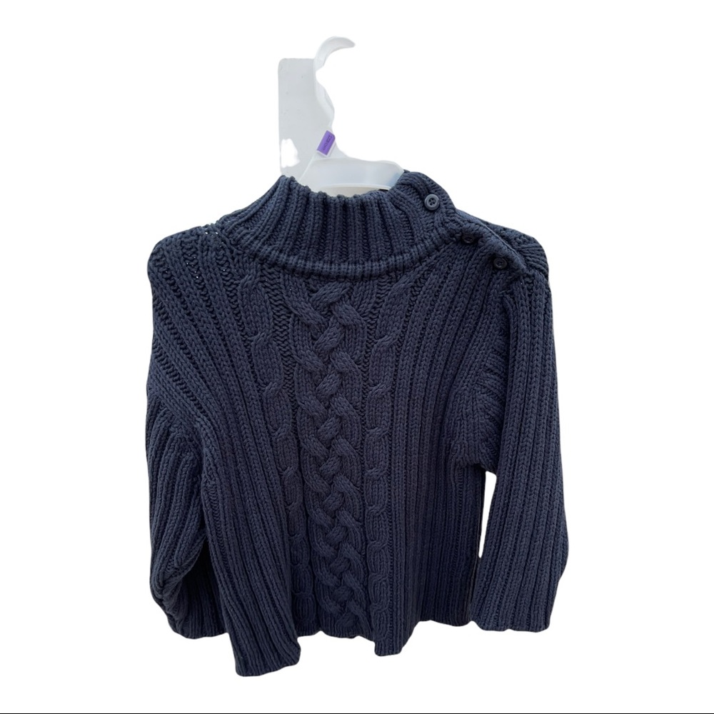 Navy blue sweater with buttons on the left shoulder